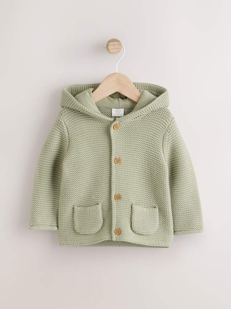 A cozy and cute organic cotton knitted cardigan with a hood and adorable 3D ears.