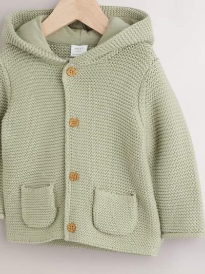 A cozy and cute organic cotton knitted cardigan with a hood and adorable 3D ears.