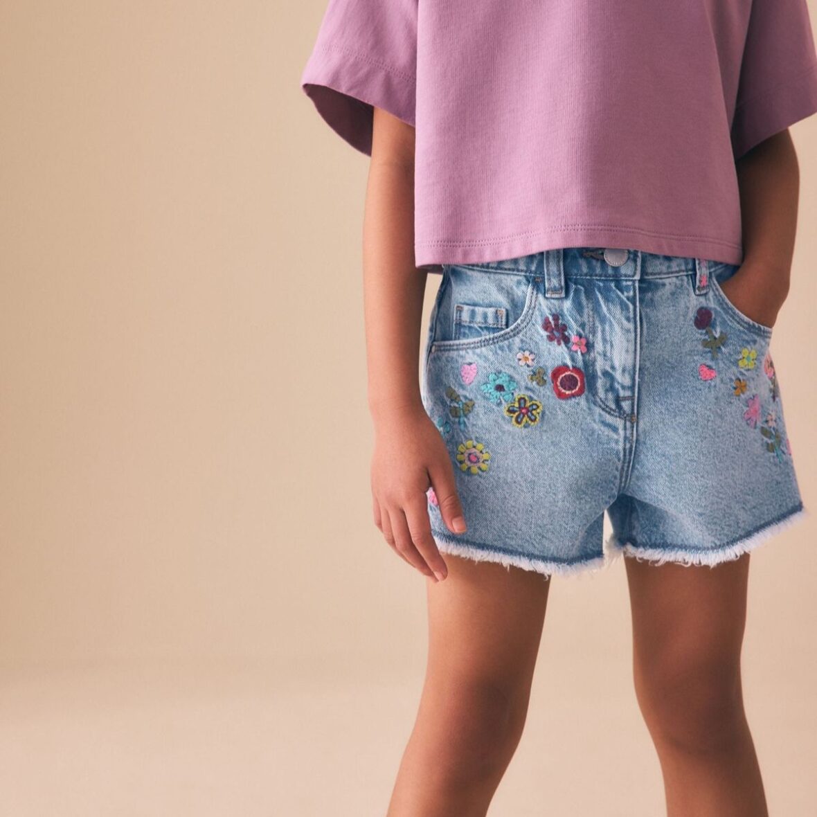 Mid Blue Embroidered Flowers Regular Length Frayed Edge Denim Shorts 1